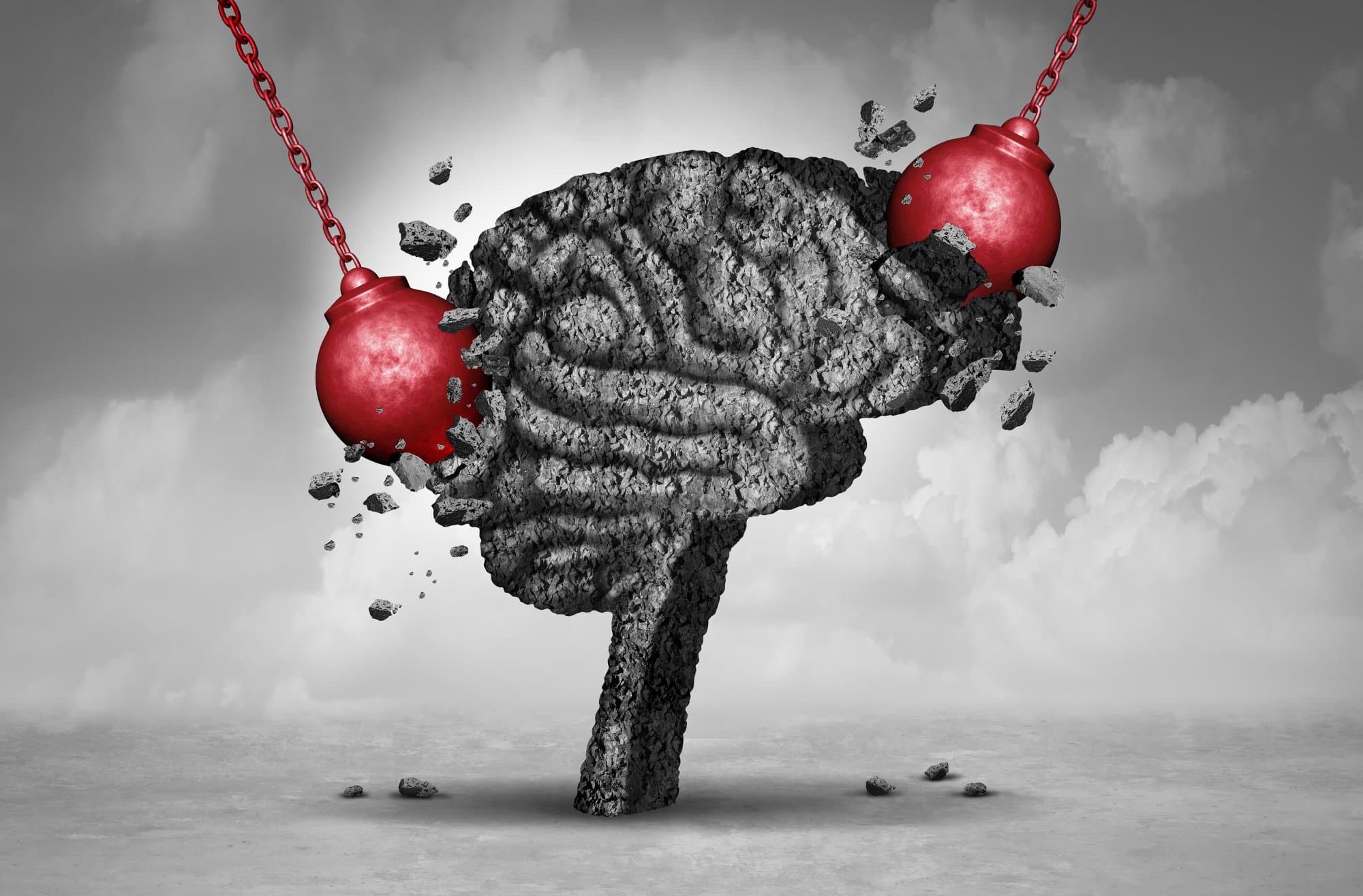 Image of brain (the organ) being struck with wrecking balls to indicate brain injury