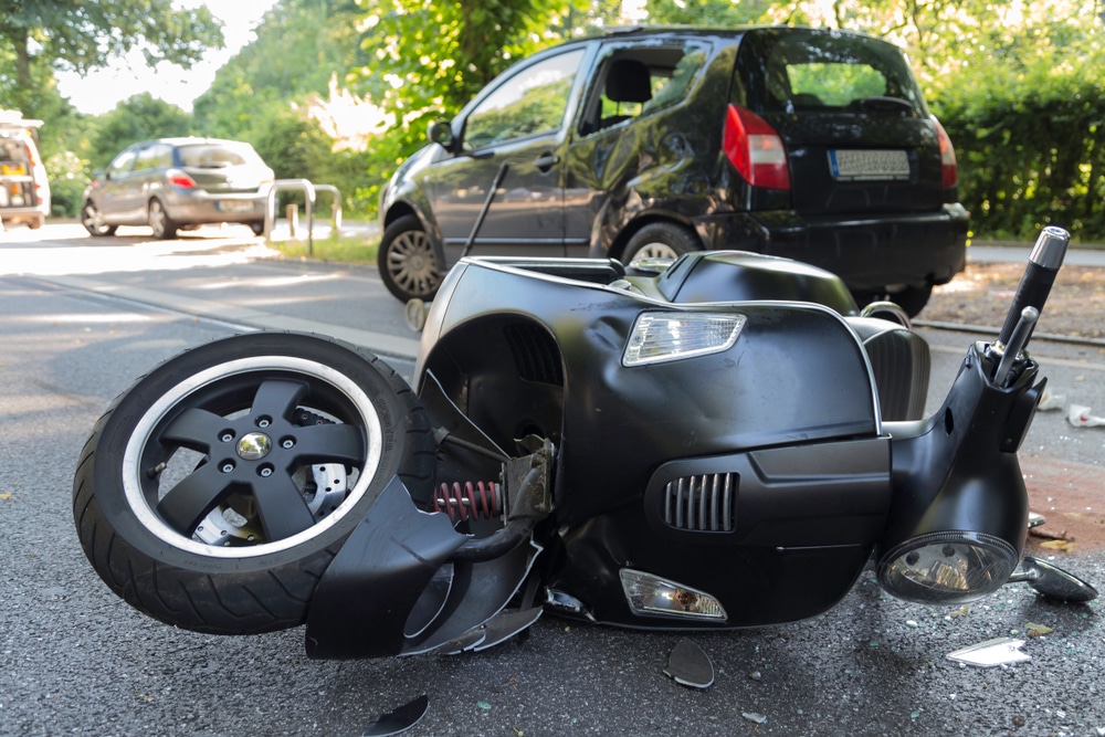A motorcycle tipped on its side after a motorcycle accident