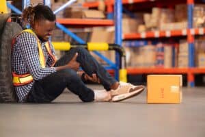 Man holds leg in pain after forklift accident in St. Louis