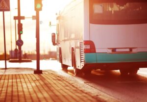 A bus driving down the street