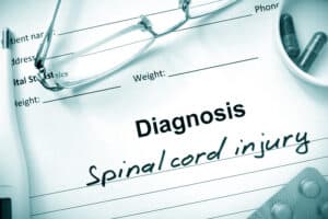 A sheet of paper that says "Diagnosis: Spinal Cord Injury"
