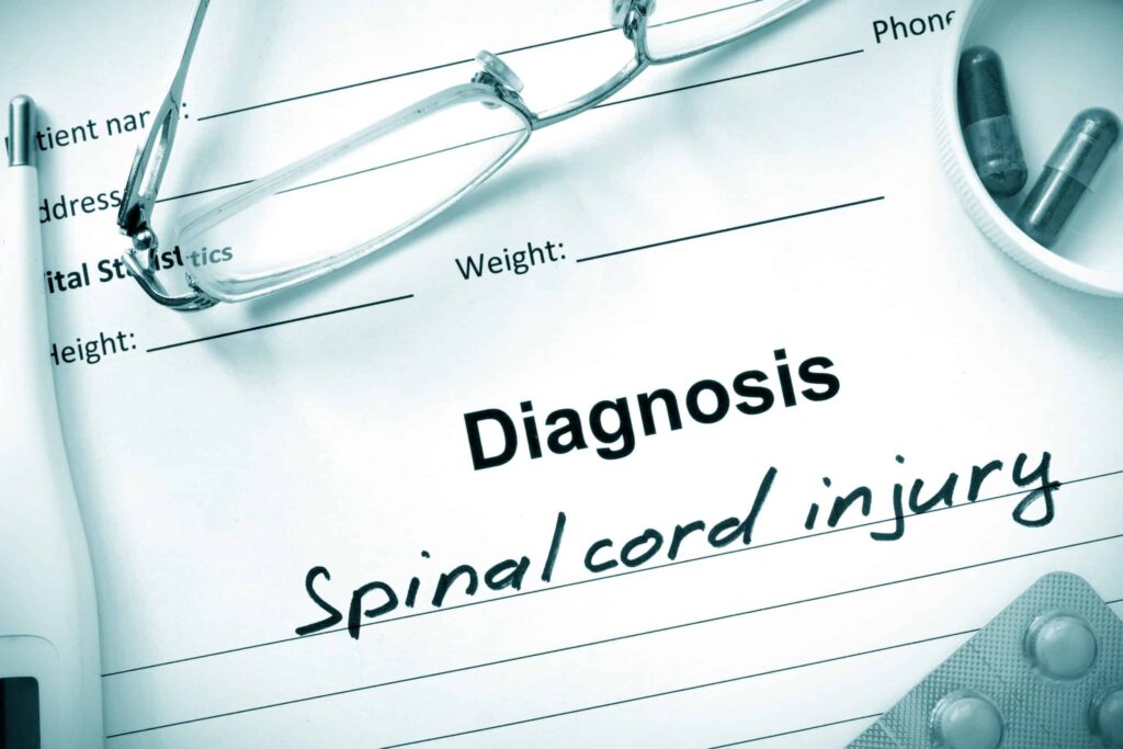 A sheet of paper that says "Diagnosis: Spinal Cord Injury"