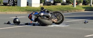 A motorcycle and helmet on the ground after a motorcycle accident in St. Louis
