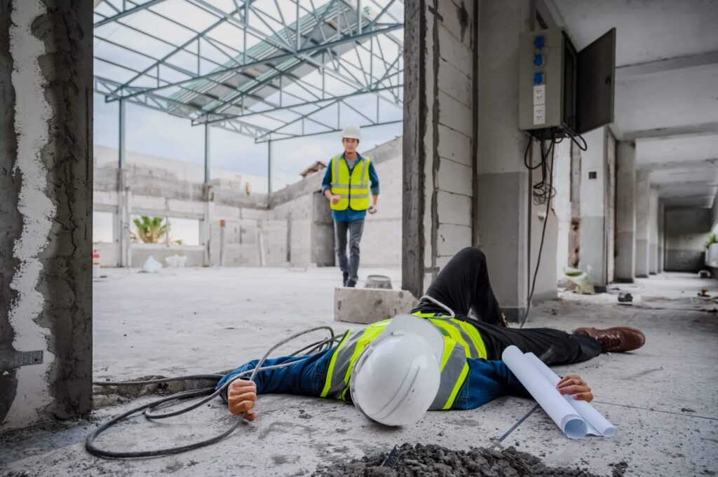 A construction worker lying on the ground after an electrocution injury in St. Louis