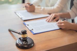 An attorney explaining a settlement in a mass tort case