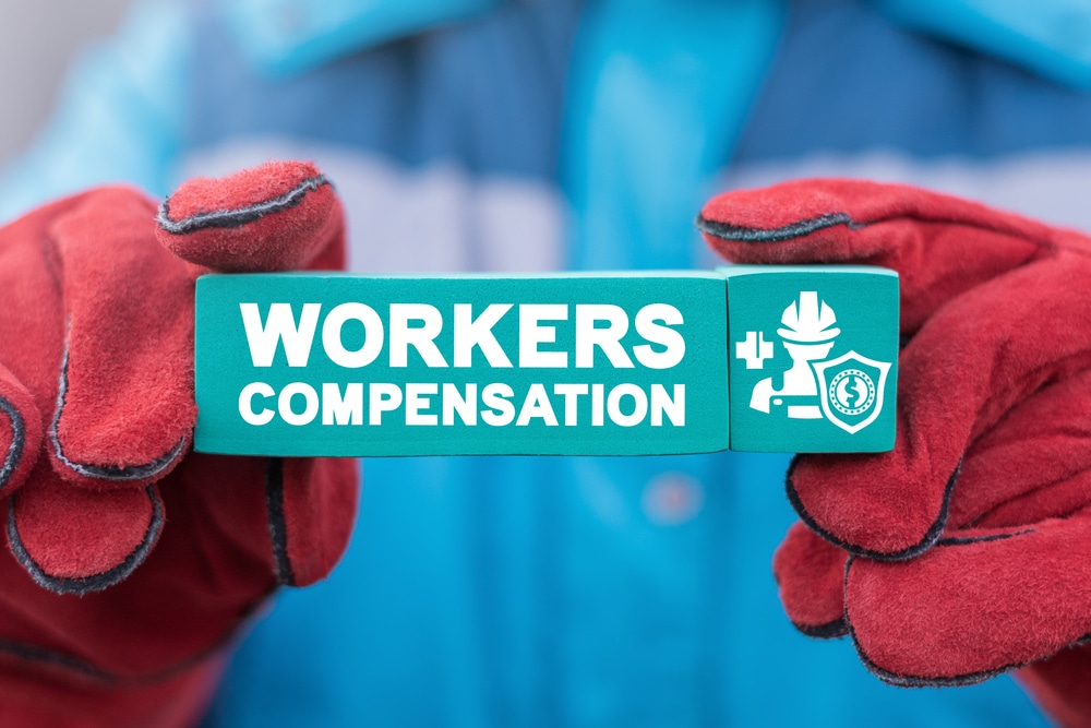 A close-up shot of blue blocks that say "workers' compensation"