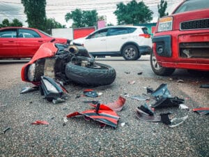 A motorcycle on the ground after a crash that caused internal bleeding