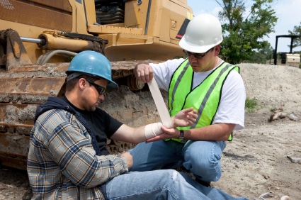 A construction worker being treated after a workplace injury