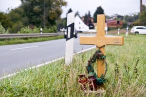 A cross on the side of the road where a wrongful death accident took place