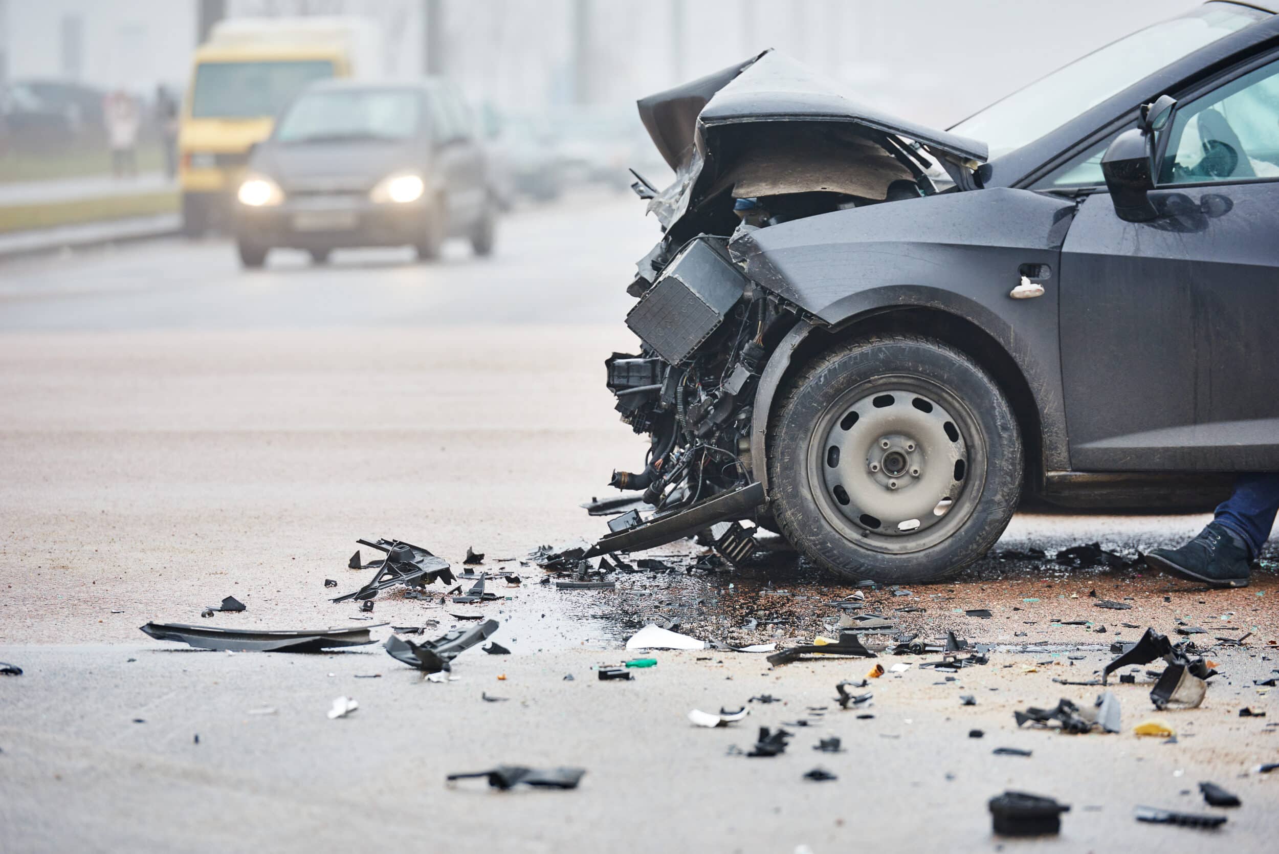 car crash accident on street damaged A damaged vehicle after a work-related car accident